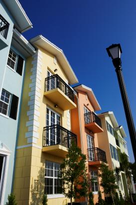 Colorful apartments against clear blue sky.
