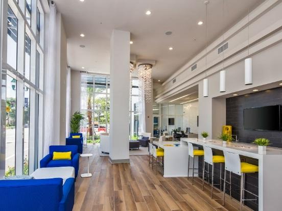 Modern lounge with bright seating and decor.