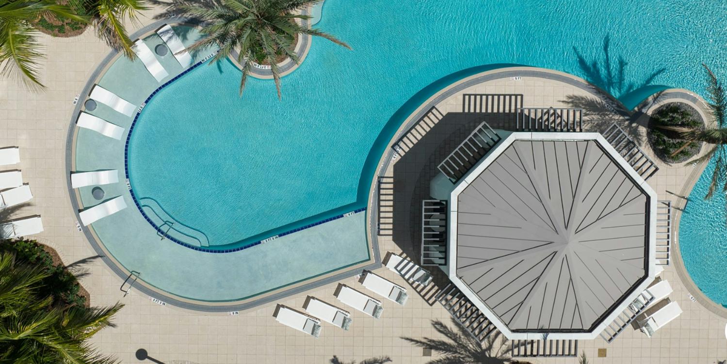 Aerial view of a pool and patio.