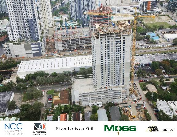 High-rise building under construction, urban skyline.