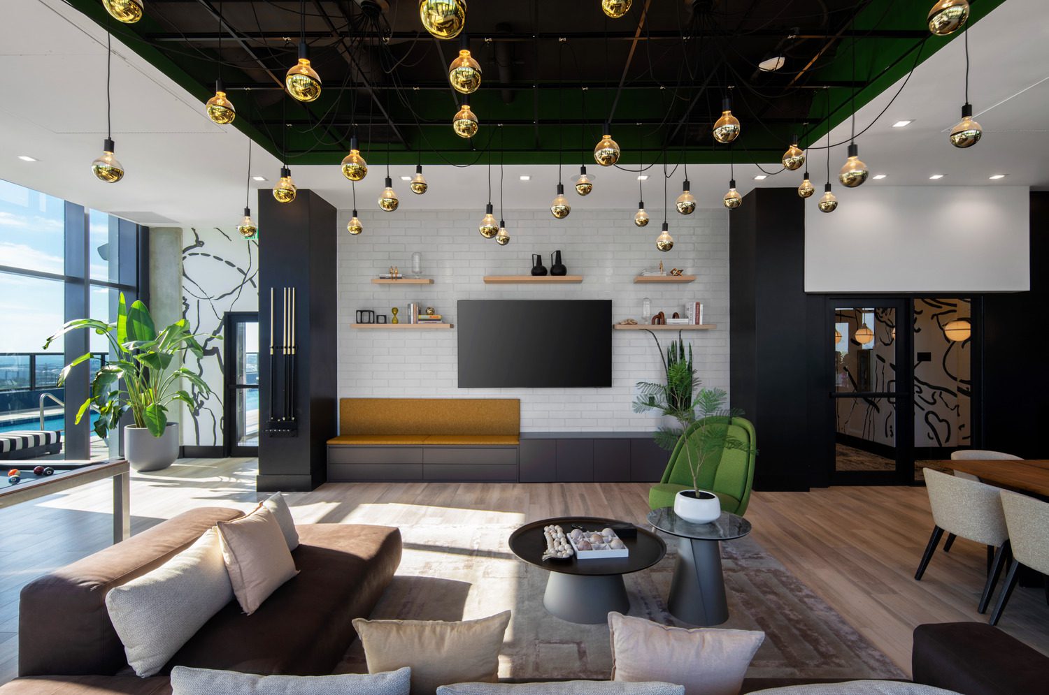 Modern living room with a sleek TV wall and cozy seating area.