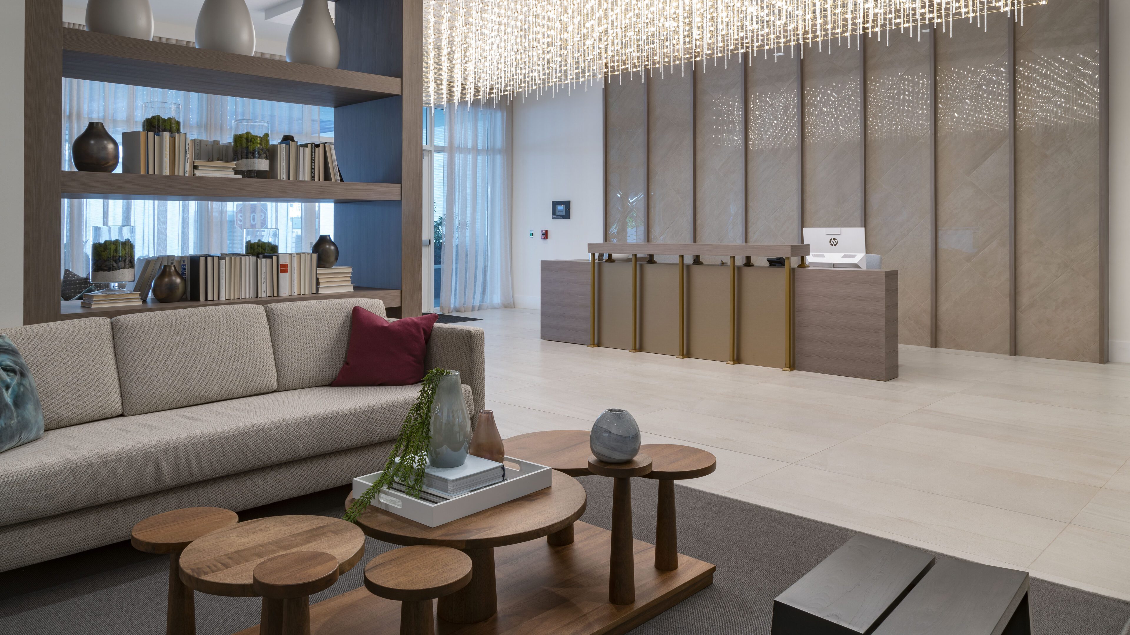 Modern living room with stylish wooden tables and a comfortable sofa.