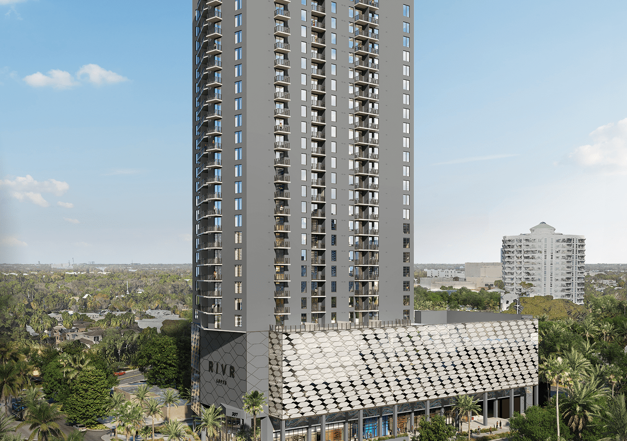 Tall modern residential building with a sleek design under clear sky.