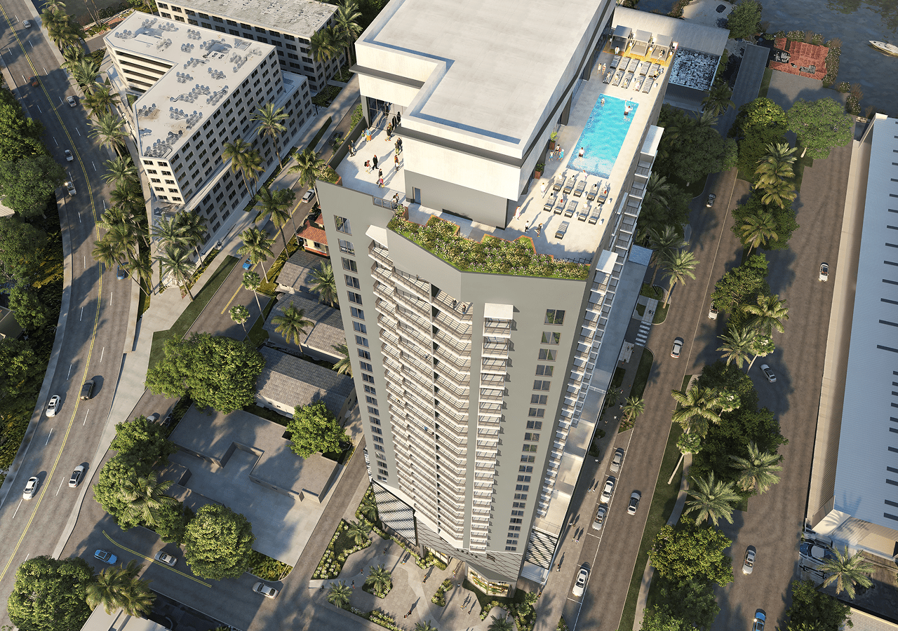 A tall modern skyscraper with rooftop pool and greenery in an urban area.