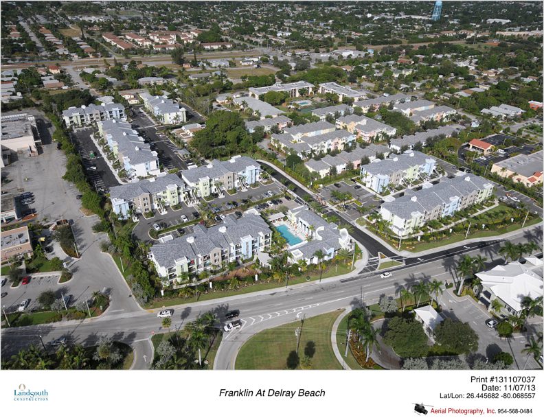 Aerial view of a modern residential neighborhood with multiple apartment buildings.