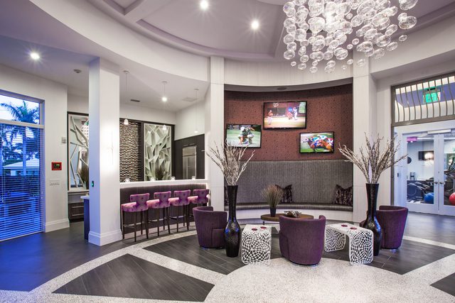 Modern lounge area with purple accents and elegant decor.