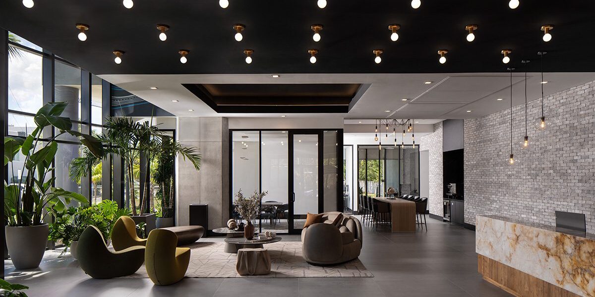 Modern living room with large windows and stylish furniture.